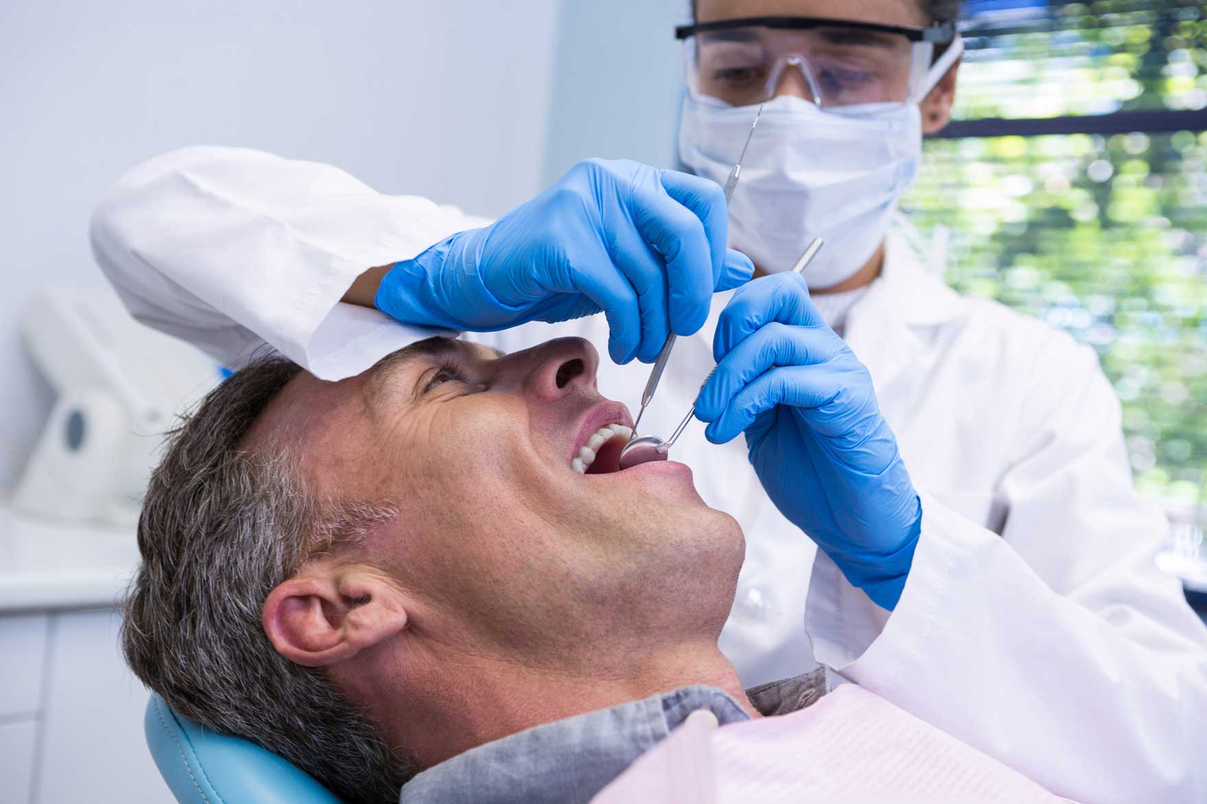 man getting oral examination